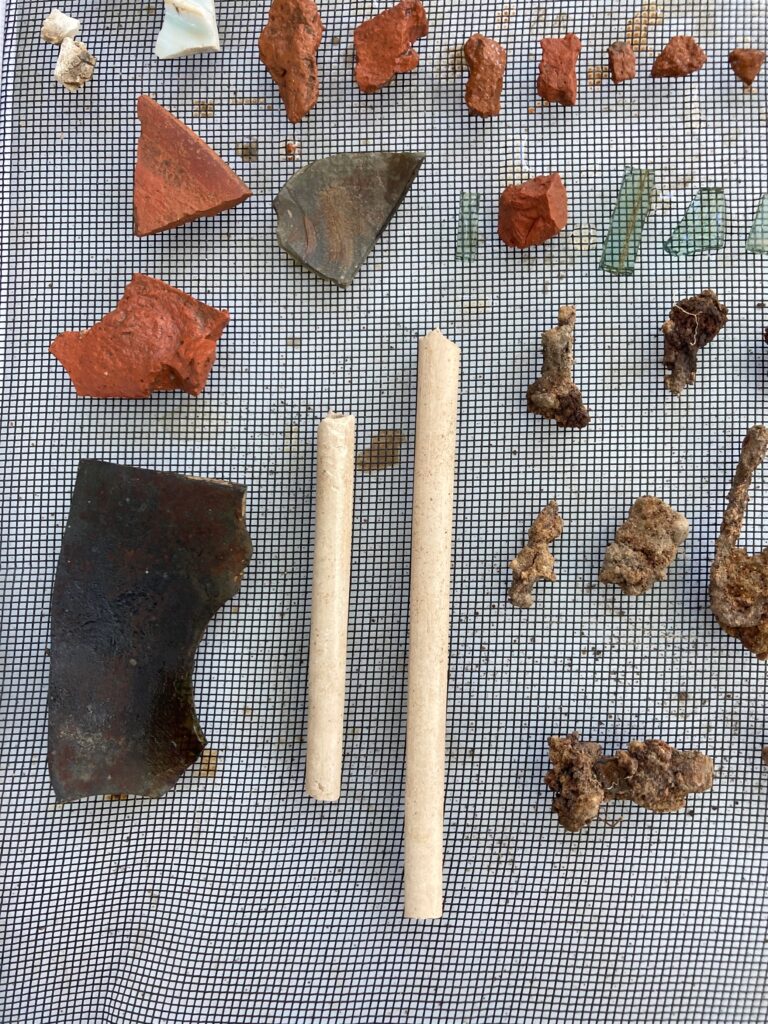 A variety of archeological fragments displayed on a screen