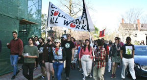 Massachusetts coffee workers march May 1 during a rally on International Workers’ Day in Cambridge.