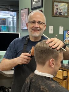 Louis Fenerlis with client Brian Alexander at his Louie’s Haircuts in Boston.