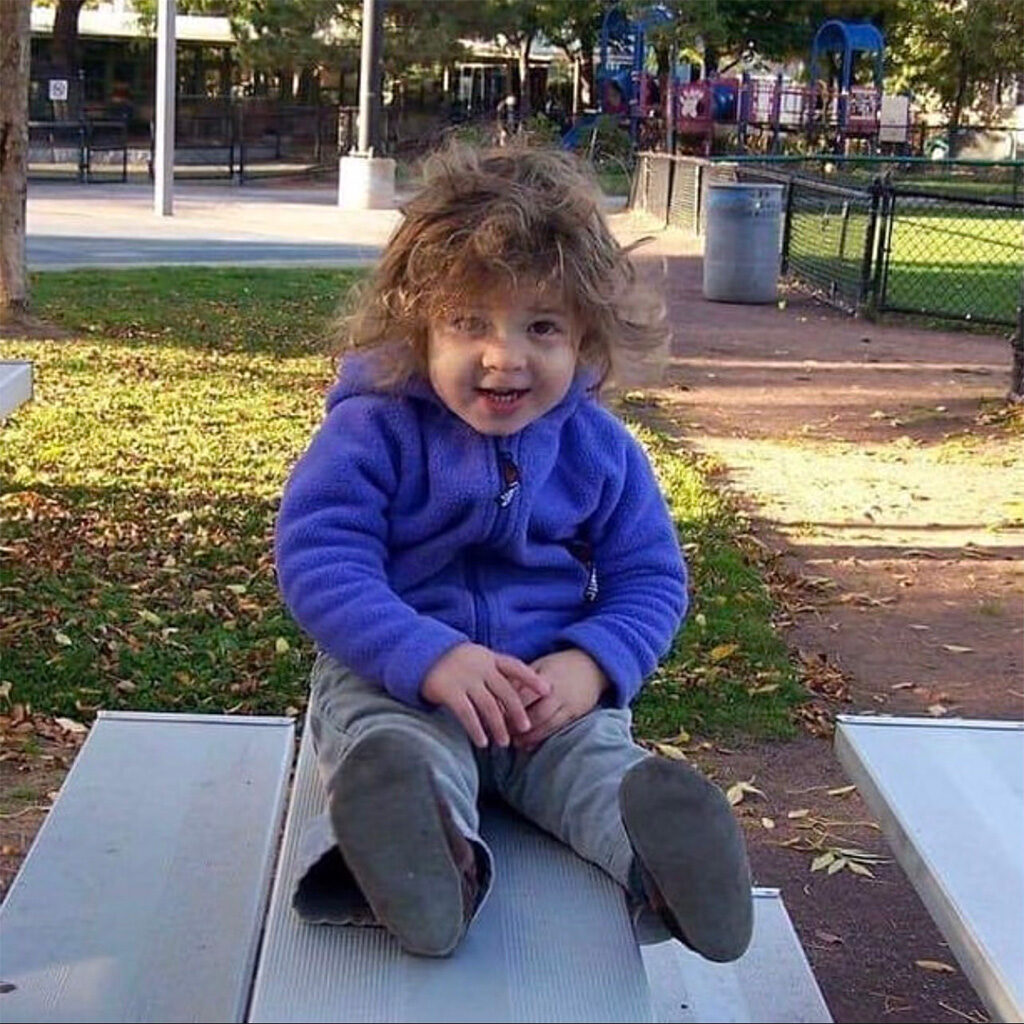 Nora Sokolovska as a toddler on the bleachers at Morse Park.