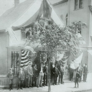 A House in North Cambridge’s “Little France” is decorated for the Fourth of July, circa 1900