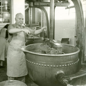 A confectioner mixes chocolate at the Daggett’s Chocolate factory in Cambridge in the mid-20th century.