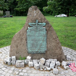 A memorial to Corporal Albert S. Teeven Jr. stands in Teeven Circle, Fresh Pond