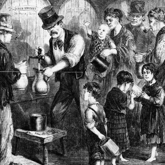 A political cartoon from the 1870s portrays Irish men, women, and even young children drinking whiskey.